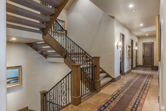 223 N Ibapah Peak Dr, Heber City, UT 84032 - stairs featuring recessed lighting and stone tile flooring