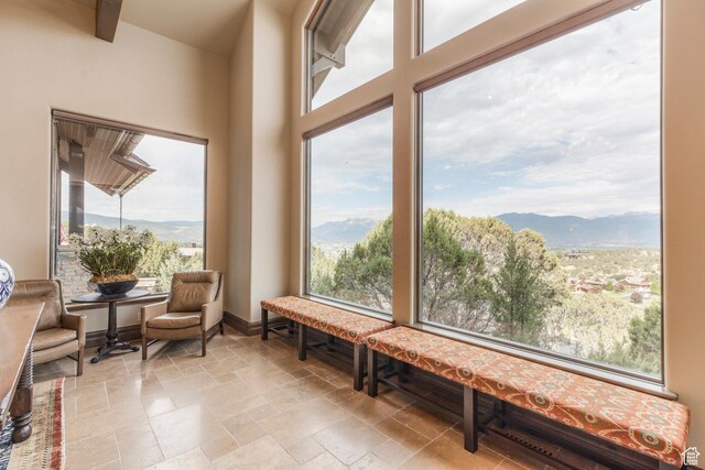 223 N Ibapah Peak Dr, Heber City, UT 84032 - living area featuring a mountain view, stone tile floors, and plenty of natural light
