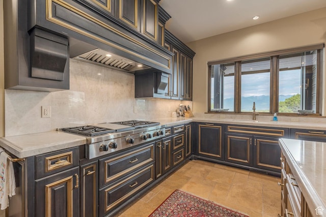 223 N Ibapah Peak Dr, Heber City, UT 84032 - kitchen featuring stainless steel gas stovetop, custom range hood, tasteful backsplash, light countertops, and recessed lighting