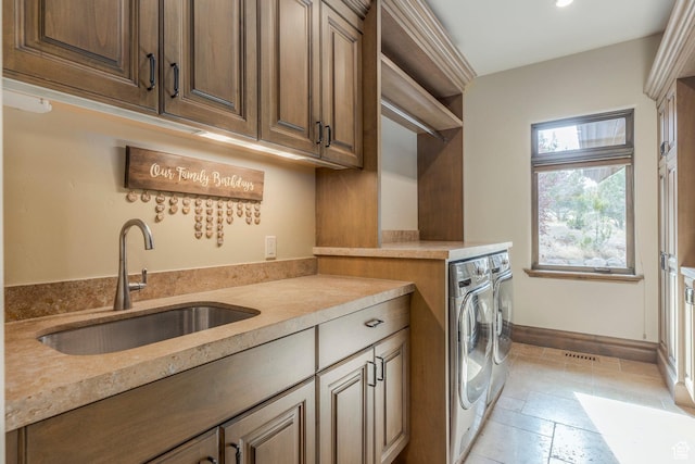 223 N Ibapah Peak Dr, Heber City, UT 84032 - laundry room featuring washing machine and dryer, cabinet space, recessed lighting, and stone tile floors