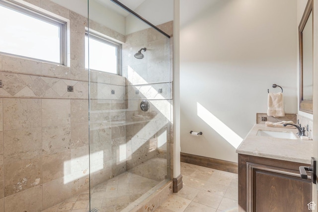 223 N Ibapah Peak Dr, Heber City, UT 84032 - bathroom featuring vanity, tiled shower, and tile patterned flooring
