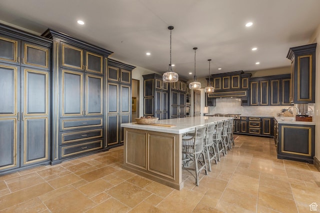 223 N Ibapah Peak Dr, Heber City, UT 84032 - kitchen featuring a large island, tasteful backsplash, a kitchen breakfast bar, recessed lighting, and pendant lighting