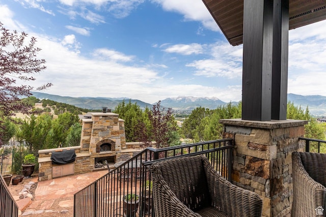 223 N Ibapah Peak Dr, Heber City, UT 84032 - balcony with an outdoor stone fireplace, a mountain view, and a grill