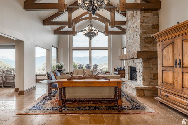 223 N Ibapah Peak Dr, Heber City, UT 84032 - living room with a chandelier, stone tile floors, high vaulted ceiling, beamed ceiling, and a fireplace