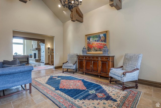 223 N Ibapah Peak Dr, Heber City, UT 84032 - living area with high vaulted ceiling, a stone fireplace, stone tile floors, and a chandelier