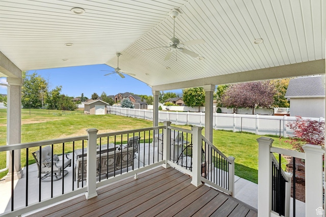 868 W Brandon Dr S, Kaysville, UT 84037 - wooden deck with ceiling fan, a residential view, and an outbuilding