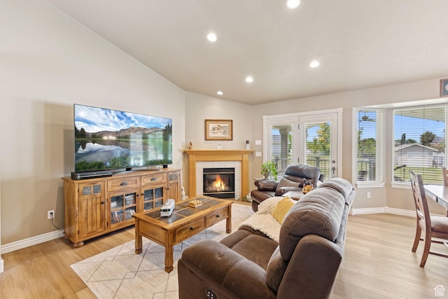 868 W Brandon Dr S, Kaysville, UT 84037 - living area featuring light wood-type flooring, vaulted ceiling, recessed lighting, and a tile fireplace