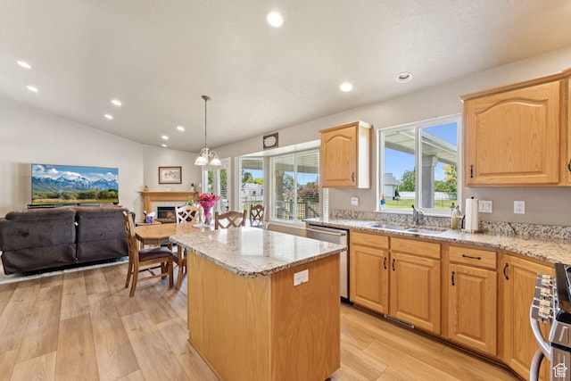 868 W Brandon Dr S, Kaysville, UT 84037 - kitchen featuring a center island, stainless steel appliances, light wood-style floors, light stone countertops, and healthy amount of natural light