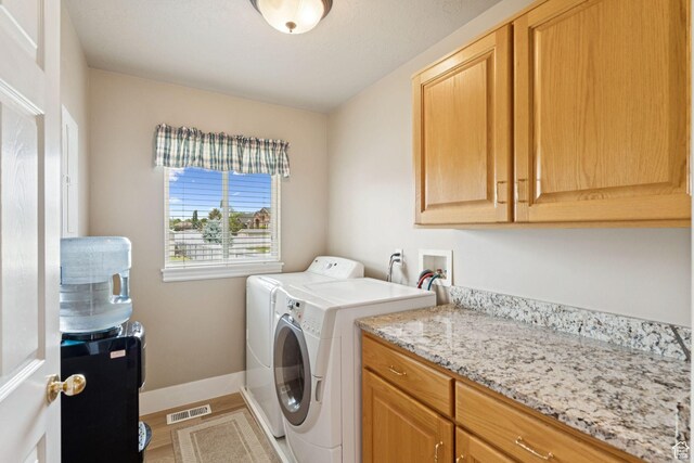 868 W Brandon Dr S, Kaysville, UT 84037 - laundry area with independent washer and dryer, cabinet space, and wood finished floors