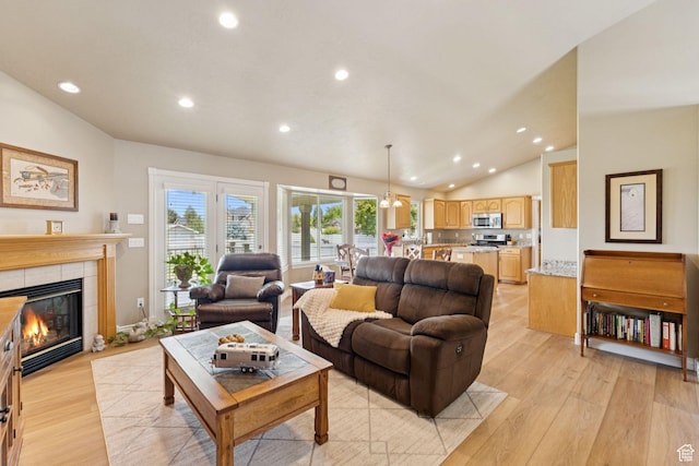 868 W Brandon Dr S, Kaysville, UT 84037 - living area with light wood-type flooring, recessed lighting, lofted ceiling, and a fireplace
