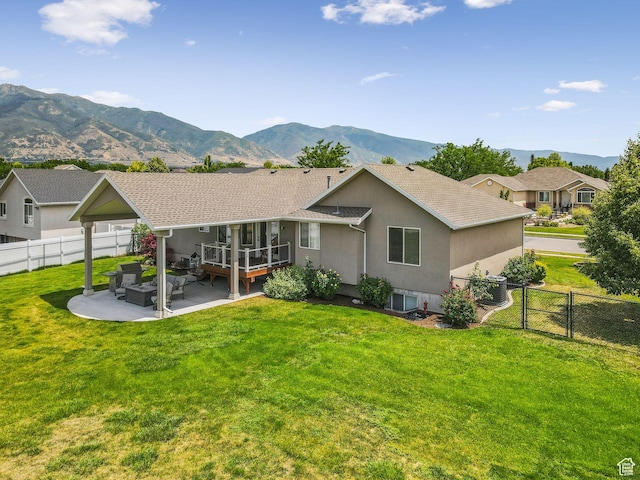 868 W Brandon Dr S, Kaysville, UT 84037 - rear view of house with a fenced backyard, stucco siding, a patio, and a mountain view