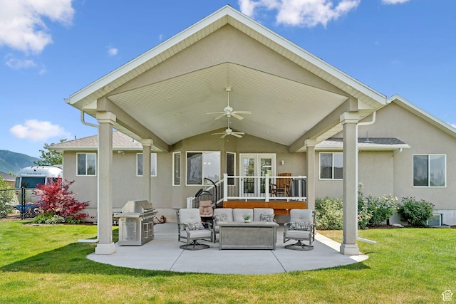 868 W Brandon Dr S, Kaysville, UT 84037 - rear view of property featuring stucco siding, a patio, and a yard