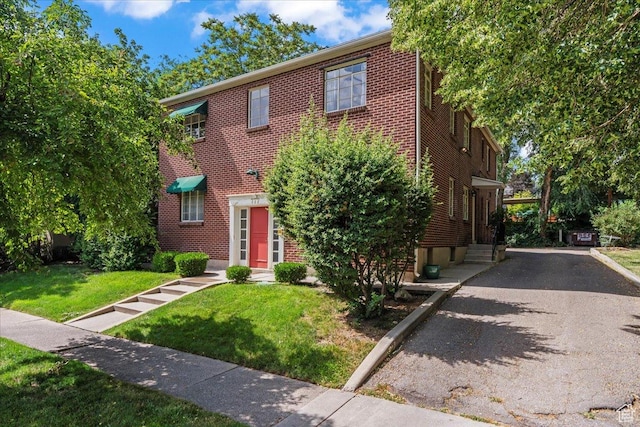 777 E 2nd Ave Unit 3, Salt Lake City, UT 84103 - view of property with a front yard and brick siding