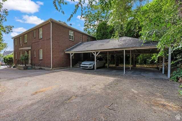 777 E 2nd Ave Unit 3, Salt Lake City, UT 84103 - view of car parking with driveway and a detached carport