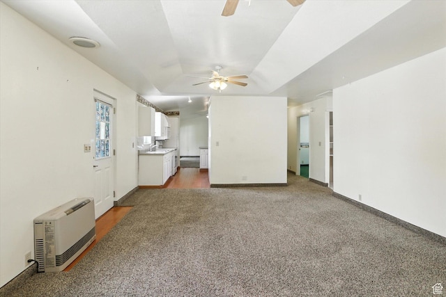390 N 400 W, Malad City, ID 83252 - unfurnished living room with ceiling fan, light carpet, and heating unit