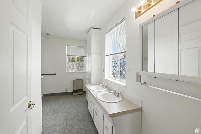 390 N 400 W, Malad City, ID 83252 - full bathroom with double vanity and baseboards