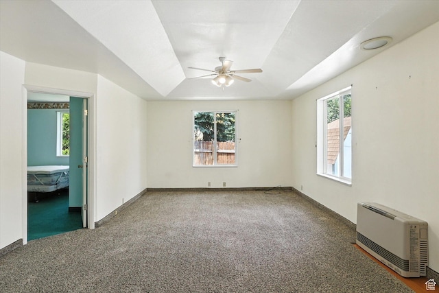 390 N 400 W, Malad City, ID 83252 - empty room featuring heating unit, a ceiling fan, and carpet