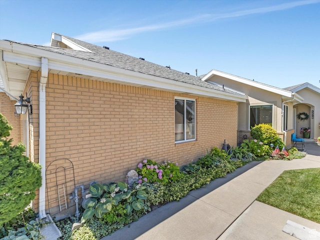 2287 N 470 E, Provo, UT 84604 - view of property exterior featuring brick siding and a shingled roof