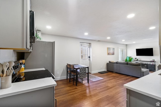 2344 E 1120 S, Spanish Fork, UT 84660 - kitchen featuring electric range, gray cabinetry, light wood-type flooring, recessed lighting, and light stone counters