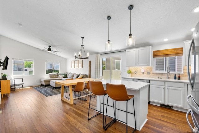 2344 E 1120 S, Spanish Fork, UT 84660 - kitchen featuring tasteful backsplash, white cabinetry, a ceiling fan, light countertops, and lofted ceiling