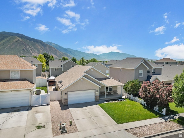 2344 E 1120 S, Spanish Fork, UT 84660 - traditional-style home featuring a gate, a residential view, driveway, and a garage