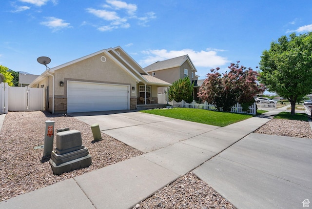 2344 E 1120 S, Spanish Fork, UT 84660 - single story home with a garage, concrete driveway, stucco siding, and a gate