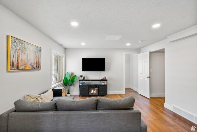 2344 E 1120 S, Spanish Fork, UT 84660 - living area featuring recessed lighting, wood finished floors, and a textured ceiling