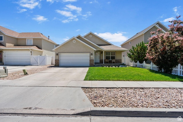 2344 E 1120 S, Spanish Fork, UT 84660 - view of front facade with an attached garage, concrete driveway, stucco siding, and covered porch