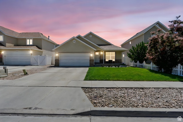 2344 E 1120 S, Spanish Fork, UT 84660 - view of front of home with an attached garage, driveway, stucco siding, and a gate