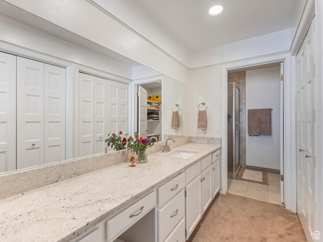 4856 S 1690 E # 88, Salt Lake City, UT 84117 - bathroom with a shower stall, vanity, and tile patterned floors