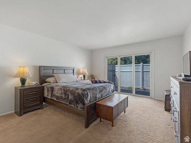 4856 S 1690 E # 88, Salt Lake City, UT 84117 - bedroom featuring access to exterior and light colored carpet