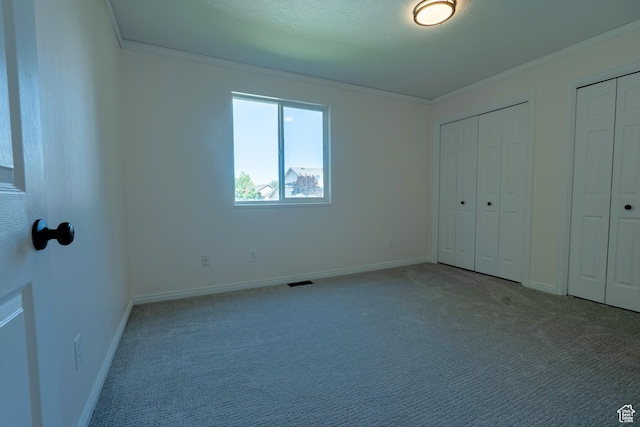 984 S 925 W, Woods Cross, UT 84087 - unfurnished bedroom with crown molding, two closets, and carpet floors