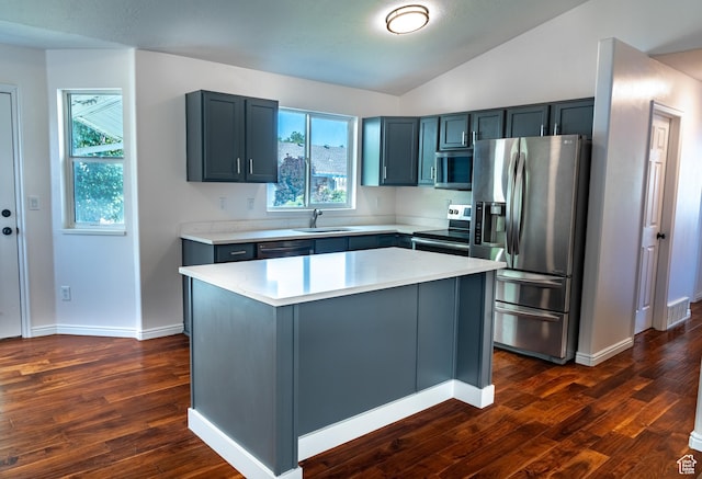 984 S 925 W, Woods Cross, UT 84087 - kitchen featuring appliances with stainless steel finishes, vaulted ceiling, dark wood-style floors, and light countertops