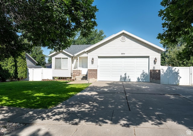 984 S 925 W, Woods Cross, UT 84087 - ranch-style home with brick siding, concrete driveway, and an attached garage