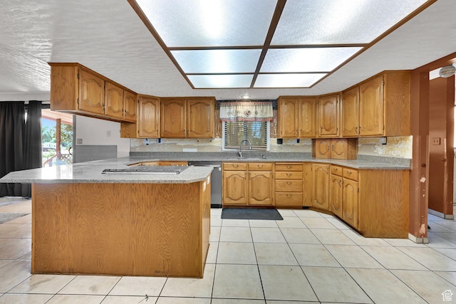 5577 W 4000 S, Hooper, UT 84315 - kitchen with stainless steel dishwasher, light tile patterned flooring, brown cabinets, light countertops, and tasteful backsplash