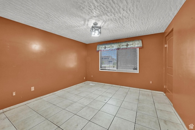 5577 W 4000 S, Hooper, UT 84315 - spare room featuring a textured ceiling and light tile patterned floors