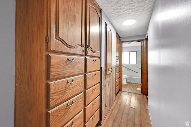 5577 W 4000 S, Hooper, UT 84315 - hallway with light wood finished floors and a textured ceiling
