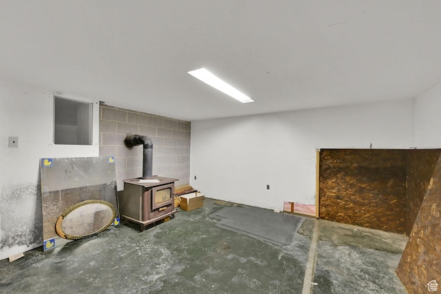 5577 W 4000 S, Hooper, UT 84315 - below grade area featuring a wood stove and concrete block wall