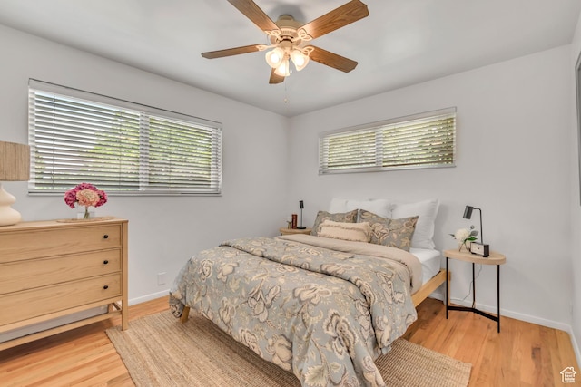 4269 S Vegas Way E, Holladay, UT 84124 - bedroom featuring multiple windows, wood finished floors, and ceiling fan