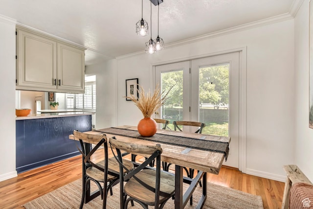 4269 S Vegas Way E, Holladay, UT 84124 - dining room featuring plenty of natural light, light wood-style flooring, and ornamental molding