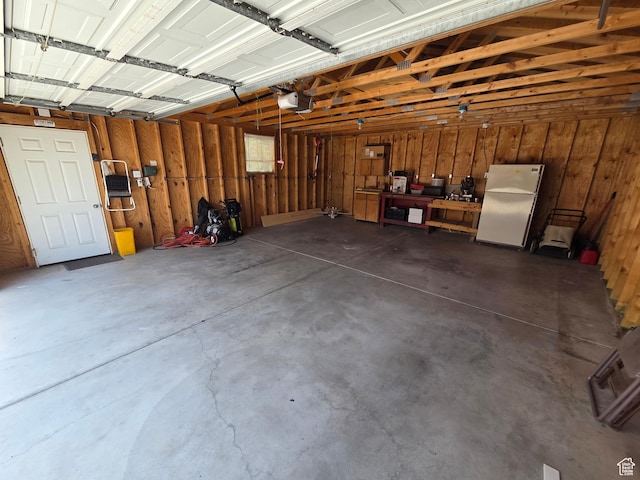 4269 S Vegas Way E, Holladay, UT 84124 - garage with freestanding refrigerator and a garage door opener