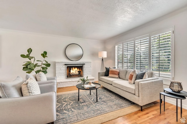 4269 S Vegas Way E, Holladay, UT 84124 - living area with crown molding, wood finished floors, a textured ceiling, and a warm lit fireplace