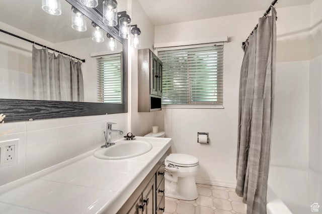 4269 S Vegas Way E, Holladay, UT 84124 - full bathroom featuring vanity, shower / bathtub combination with curtain, and tasteful backsplash