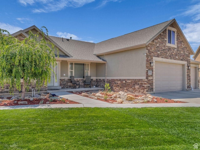 8503 S Spiral Jetty Cir W Unit 2083, West Jordan, UT 84081 - view of front facade featuring stucco siding, a front lawn, and concrete driveway