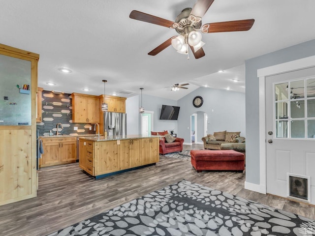 8503 S Spiral Jetty Cir W Unit 2083, West Jordan, UT 84081 - living room with dark wood-style flooring, a ceiling fan, lofted ceiling, recessed lighting, and arched walkways