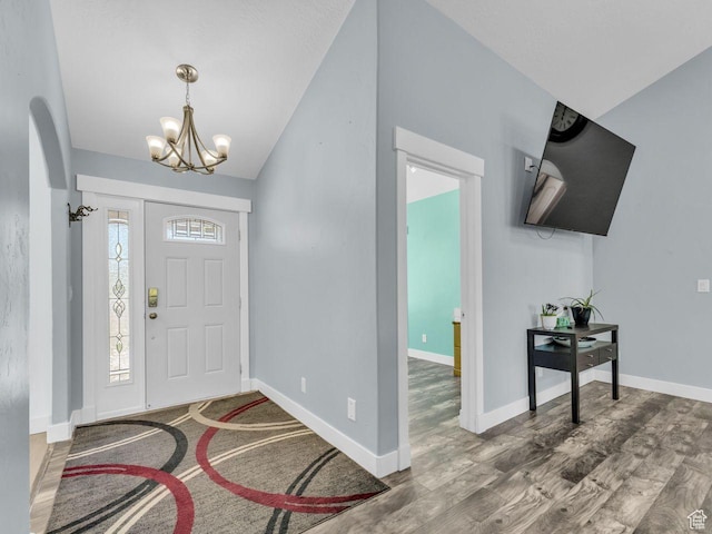 8503 S Spiral Jetty Cir W Unit 2083, West Jordan, UT 84081 - foyer with a chandelier, lofted ceiling, wood finished floors, and arched walkways