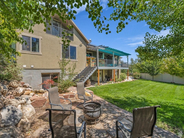 8503 S Spiral Jetty Cir W Unit 2083, West Jordan, UT 84081 - rear view of house featuring stairs, a fire pit, stucco siding, a deck, and a pergola