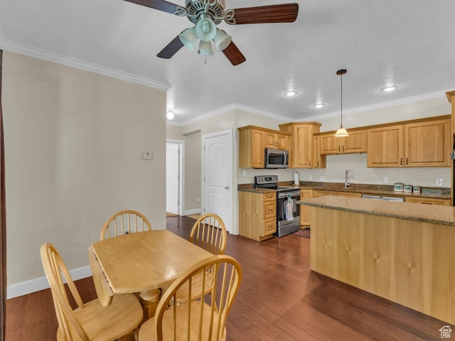 8503 S Spiral Jetty Cir W Unit 2083, West Jordan, UT 84081 - kitchen with appliances with stainless steel finishes, a ceiling fan, ornamental molding, dark wood-type flooring, and dark stone countertops