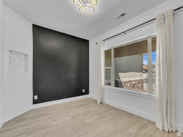 8503 S Spiral Jetty Cir W Unit 2083, West Jordan, UT 84081 - empty room with wood finished floors and a textured ceiling