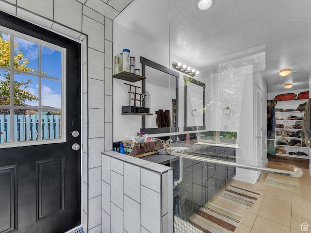 8503 S Spiral Jetty Cir W Unit 2083, West Jordan, UT 84081 - bathroom with tile patterned flooring, vanity, and a textured ceiling